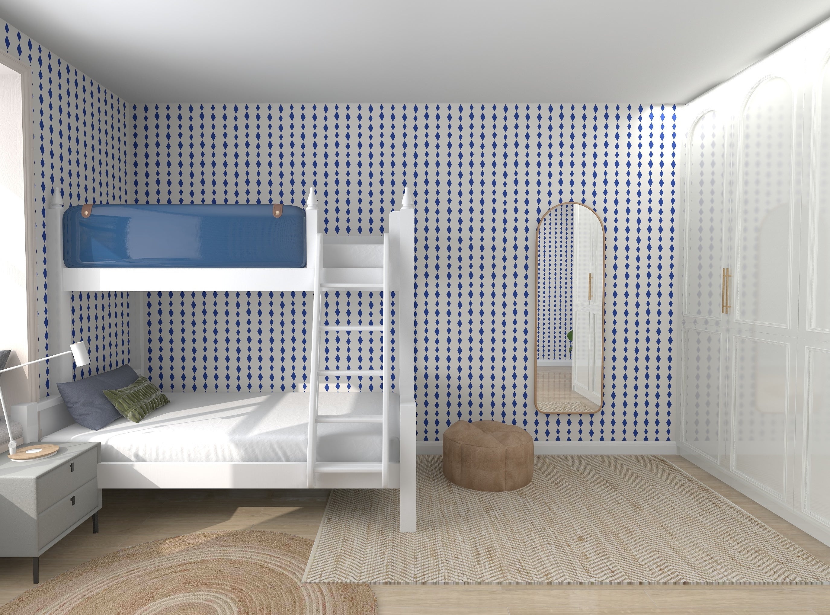 A bedroom features munks and mes Jolly Jester Wallpaper in royal blue and white patterns, a white bunk bed with an unmade lower bunk, a round beige pouf, a rug, nightstand with lamp, and arched mirror. The vibrant colors enhance the tranquil aesthetic.