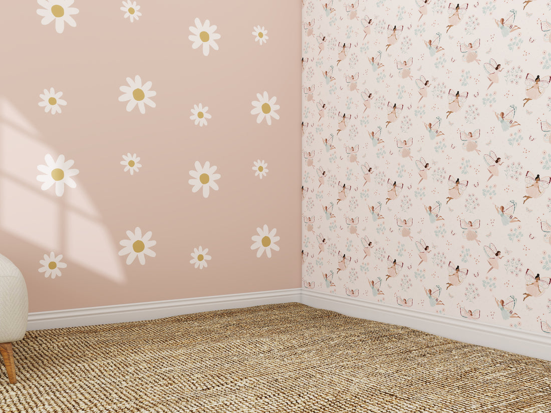 A corner room with tan woven carpet features one wall in Custom Large Daisy Floral Wallpaper Repeat Pattern—white and yellow daisies on pink—while sunlight adds gentle shadows across the space.