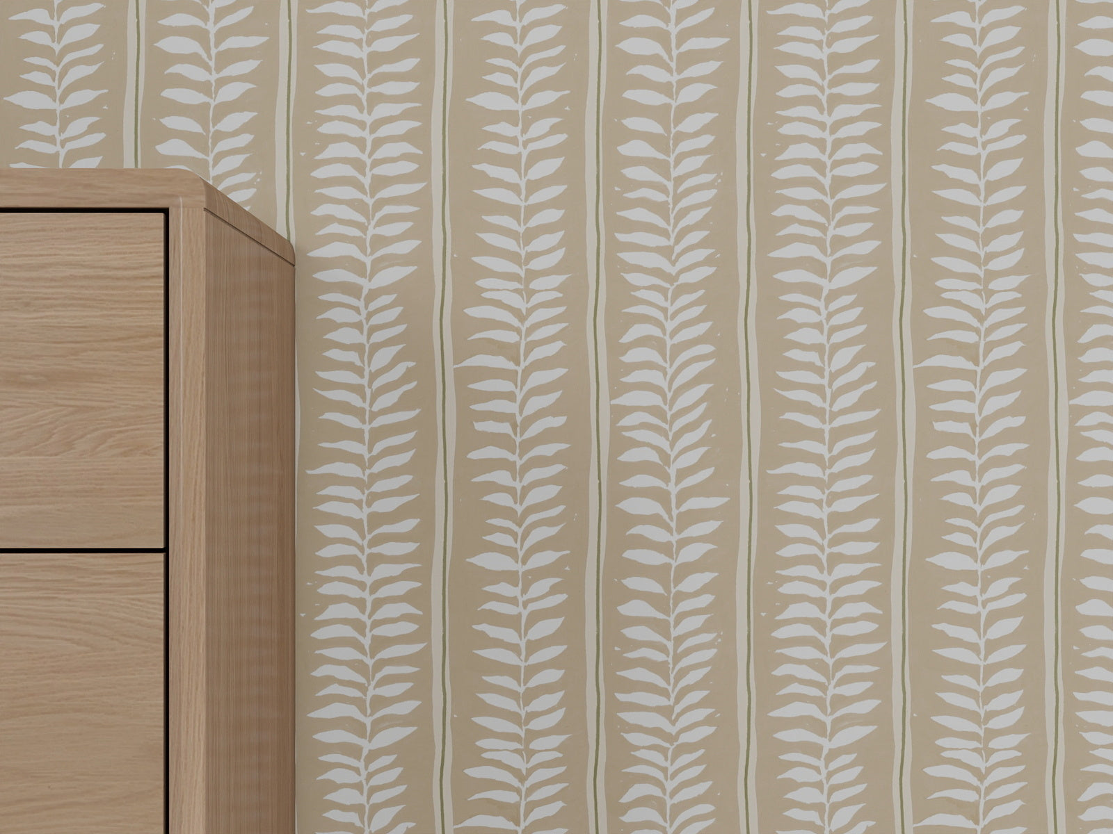 A light wood furniture piece stands beside a beige wall covered in Meadow Leaf Stripe Wallpaper, Clay, adding a modern and nature-inspired touch to the space.