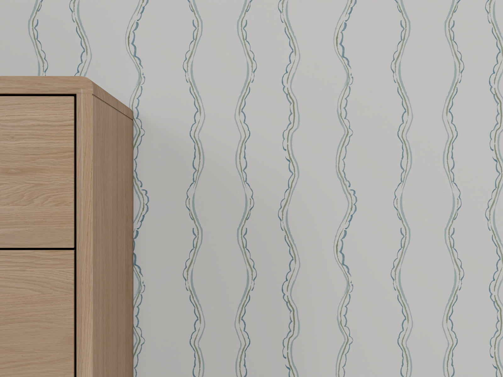 A light wooden cabinet is partially visible on the left, beside a white wall adorned with Ribbon Stripe Wallpaper, Blue, featuring subtle vertical wavy blue lines.