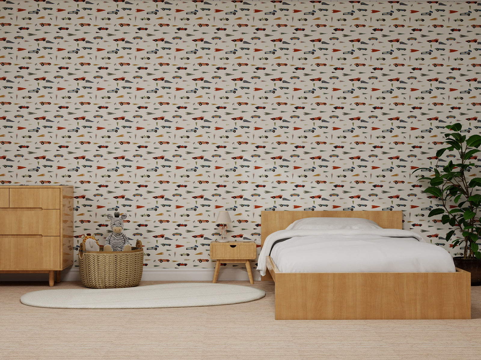 A cozy bedroom features a wooden bed, nightstand, dresser, white rug, potted plant, and Speedway Dash Wallpaper with colorful cars. A basket with a stuffed animal sits by the dresser—perfect wall decor for little car lovers.
