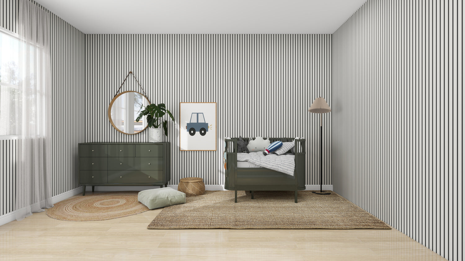 A minimalist nursery with green accents features a crib, dresser, and floor lamp. The walls have Pinstripe Wallpaper Charcoal by munks and me, and the light wood floor has a woven rug. A round mirror, plant, and toy car artwork complete the decor.