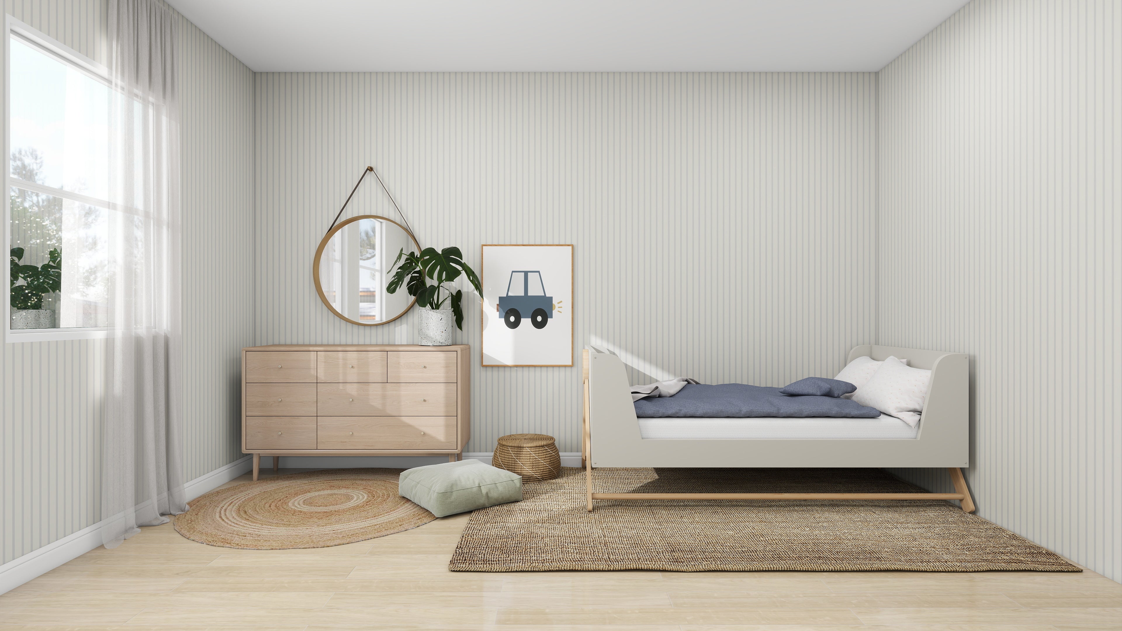 A minimalist bedroom features a small bed with blue bedding on the right. On the left, a dresser with a round mirror sits below a framed car print, enhanced by munks and mes Pinstripe Wallpaper Sky. A wicker basket, cushion, and circular rug adorn the wooden floor.