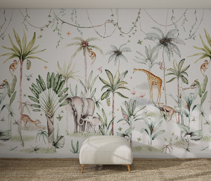 The Safari Wonderland Wallpaper Mural features playful elephants, giraffes, monkeys, and birds among lush green plants in a whimsical watercolor style—ideal for adding charm to any kids&