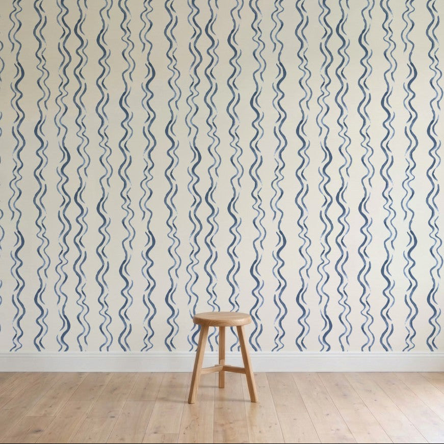 Wallpaper with blue wavy lines on a white background, featuring a wooden stool.