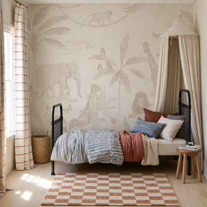 Children’s bedroom with an African Safari Mural, Neutral as a stunning feature wall, showcasing a single bed with layered bedding and a canopy. The room is styled with a round stool, wicker basket, and checkered rug atop a light wooden floor. Sunlight pours in through the window dressed in striped curtains, completing this playful children’s room decor.