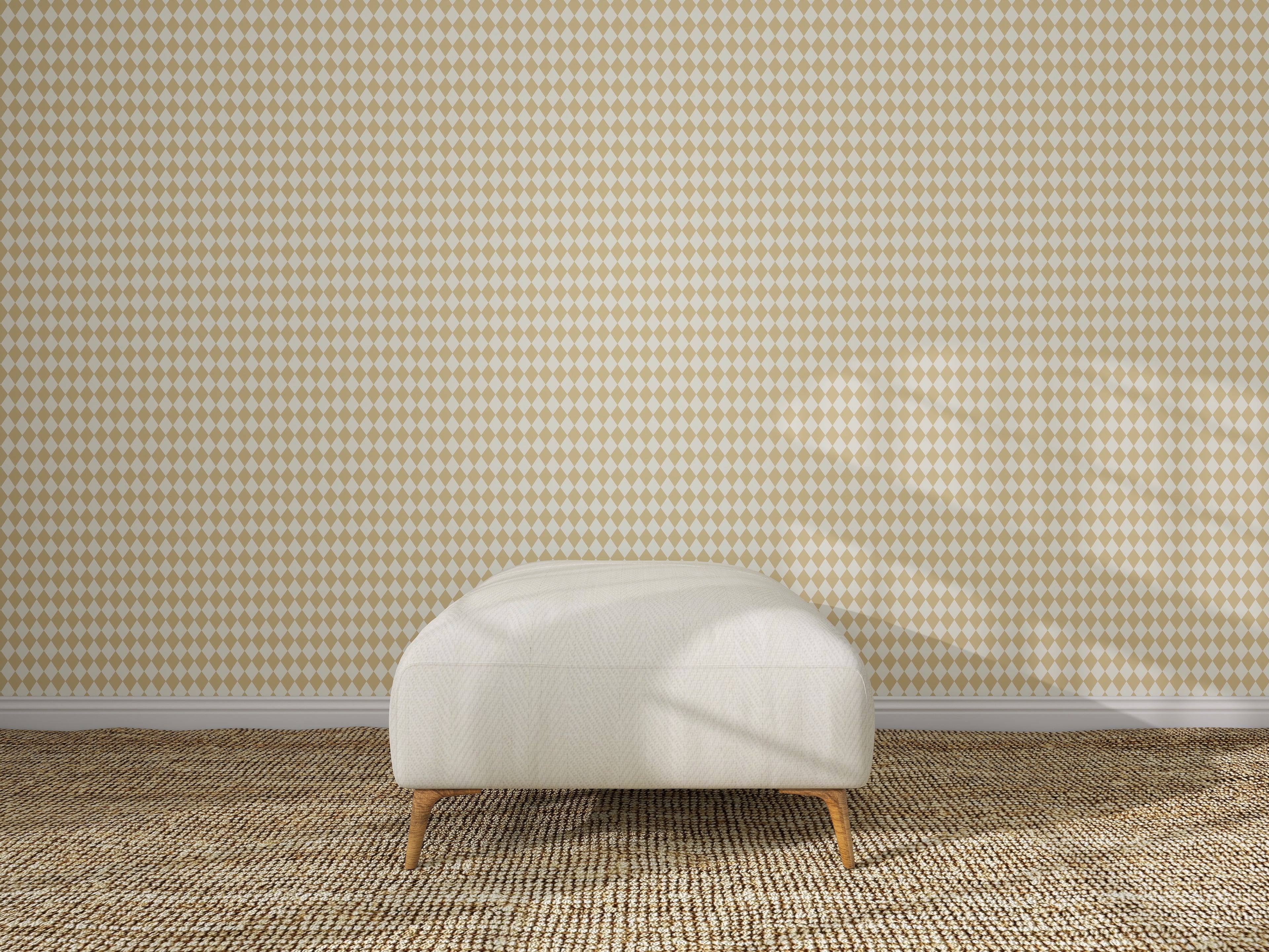 A white upholstered ottoman with wooden legs sits on a textured beige carpet in front of Diamond Dancer Wallpaper, Yellow. Sunlight casts soft shadows across the scene, highlighting the geometric diamond pattern.
