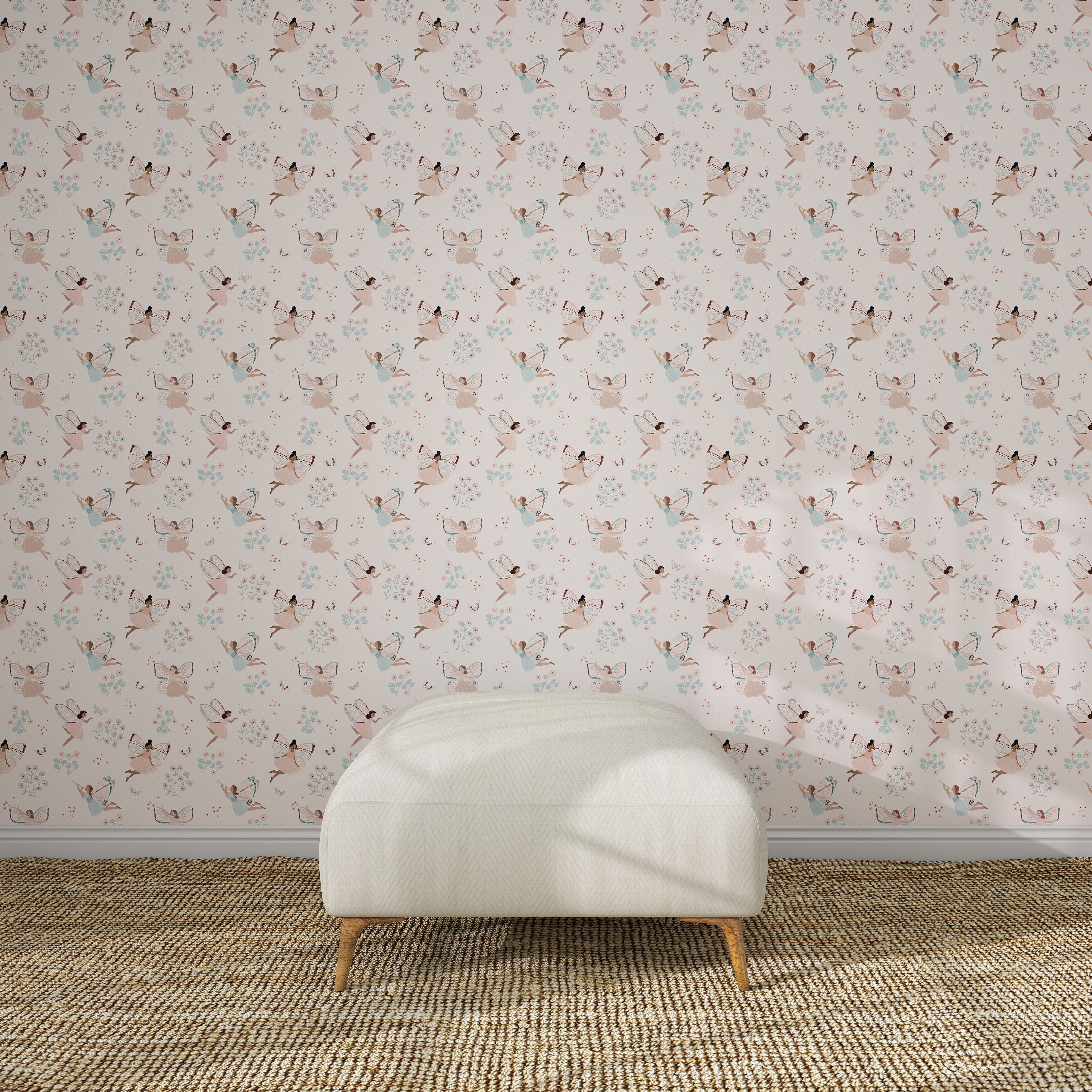 A white upholstered bench on a brown woven rug sits against a light pink wall decorated with Fairy Wonderland Pinks Wallpaper Repeat Pattern, featuring illustrated cats and flowers in a kids&