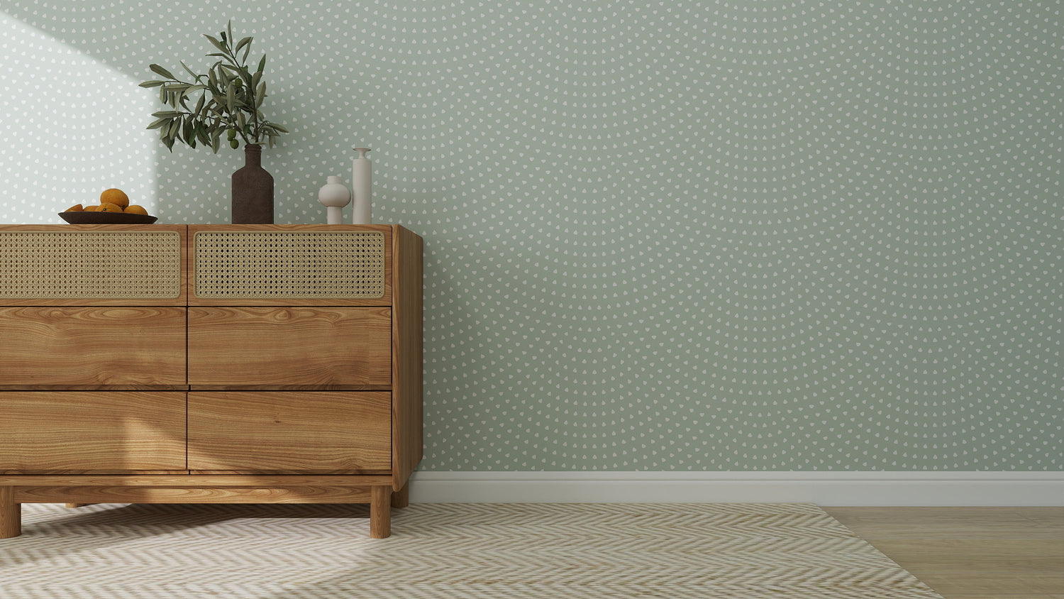 A wooden dresser with vases and a plant sits against Scallop Shell Wallpaper | Turquoise, its dotted wave pattern brightening the playroom. A beige chevron rug covers the floor, adding softness to the minimal, modern scene.