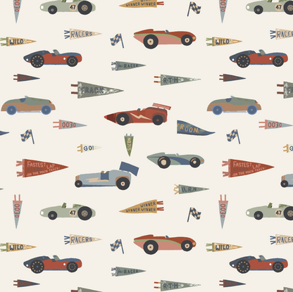 Speedway Dash Wallpaper features a seamless pattern of vintage race cars, flags, and "winner" banners on a light beige background—ideal as nursery decor or for adding retro racing style to any space.