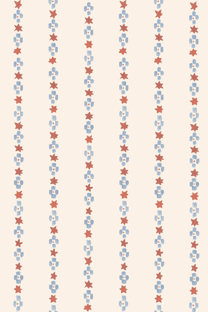 The Jacquard Stars Wallpaper, Red features vertical rows of hand-painted red stars and blue squares on a light beige background, creating an evenly spaced, retro look that&
