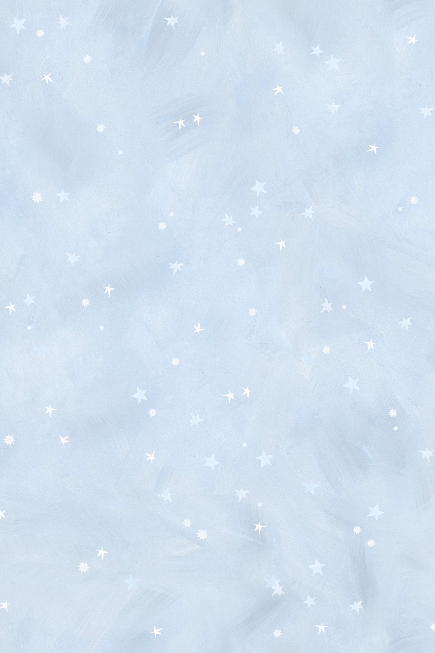 The Painted Cloud Stars Wallpaper, Blue, features a light blue textured background with small white stars and dots for a soft, dreamy night sky look—ideal as celestial nursery decor.