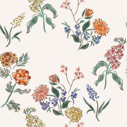 Wildflower Posy hand-drawn floral wallpaper with pink, blue, coral and ochre flowers on a warm cream background.