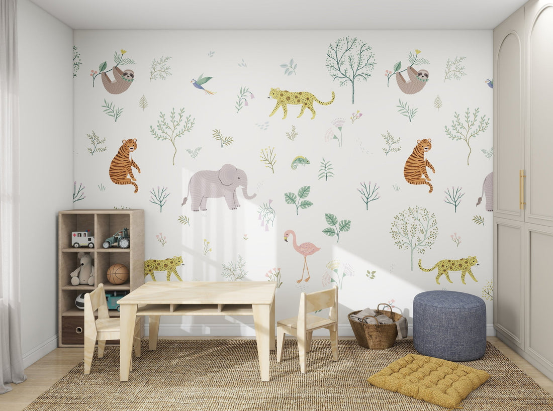 The childrens room showcases munks and mes Wild Wonders Wallpaper Mural with sloths, leopards, and flamingos. A wooden table set sits on a woven rug amidst toys and storage baskets. Explore this vibrant style in our online imagery collection.