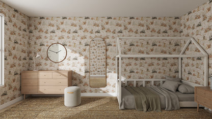 A cozy kids’ bedroom features Woodland Wonder Repeat Pattern wallpaper in playful colours, a wooden house-frame bed, green blanket, dresser with round mirror and clock, oval wall mirror, small ottoman, and woven rug.