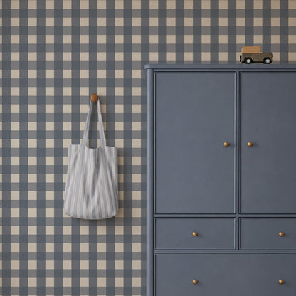 A grey cabinet with a toy car on top and a striped tote bag hanging on a Large Check Wallpaper, Deep Blue wall.