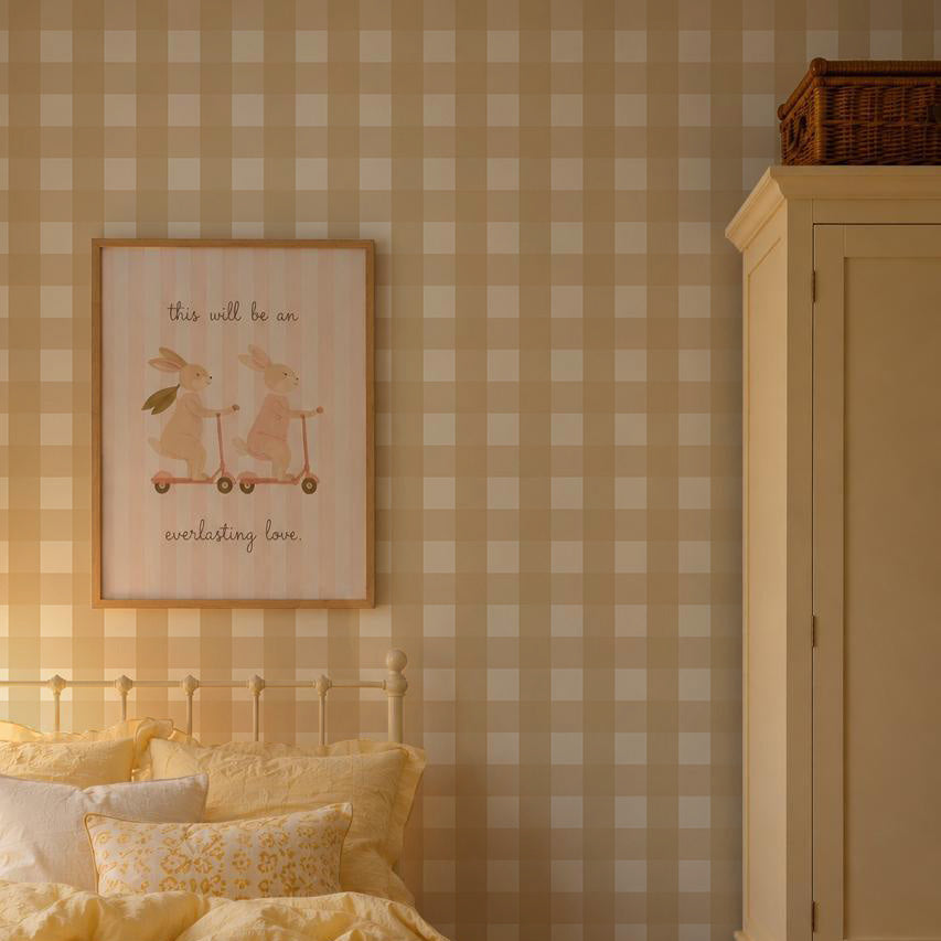A framed wall print featuring two illustrated rabbits on scooters with the text, this will be an everlasting love, displayed against Large Check Wallpaper, Yellow.