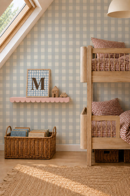 A child’s bedroom featuring a wooden bunk bed, a scalloped shelf holding a framed letter M, and a woven basket filled with books against a backdrop of Large Check Wallpaper Sample, Blue.