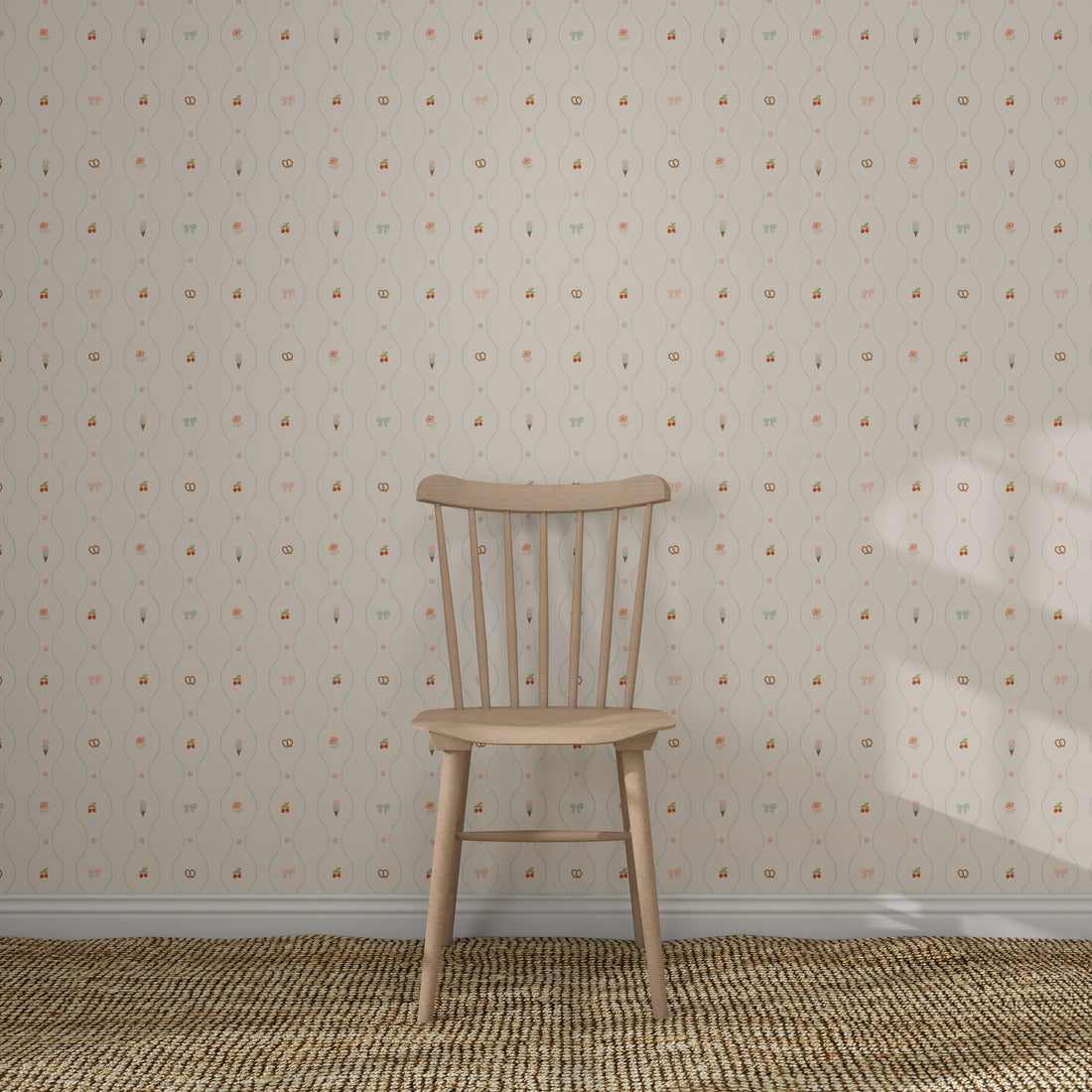 A simple wooden chair rests on a woven rug in front of a cream wall decorated with Little Patisserie Stripe Wallpaper, featuring subtle, vintage-style hand-drawn stripes.