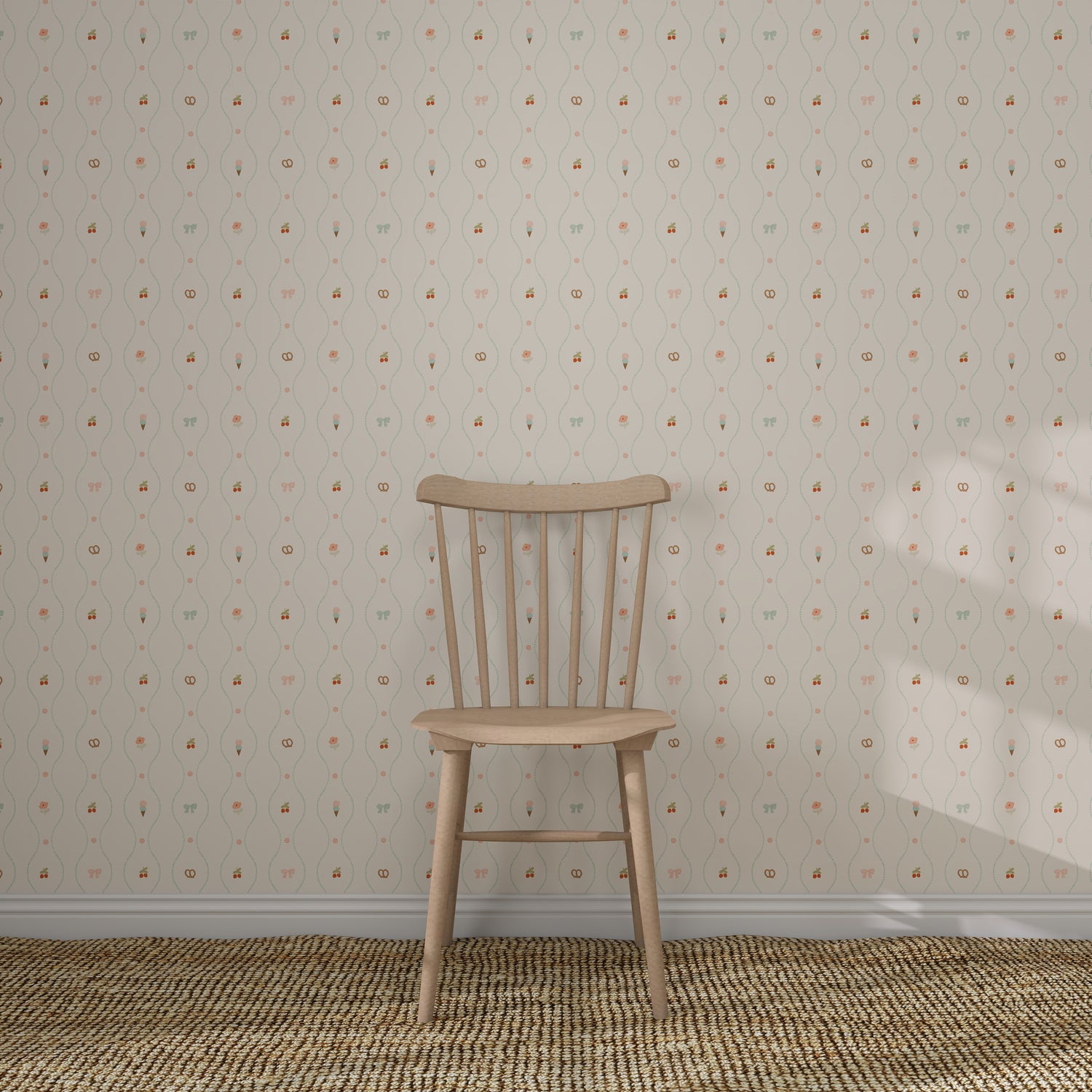 A simple wooden chair rests on a woven rug in front of a cream wall decorated with Little Patisserie Stripe Wallpaper, featuring subtle, vintage-style hand-drawn stripes.