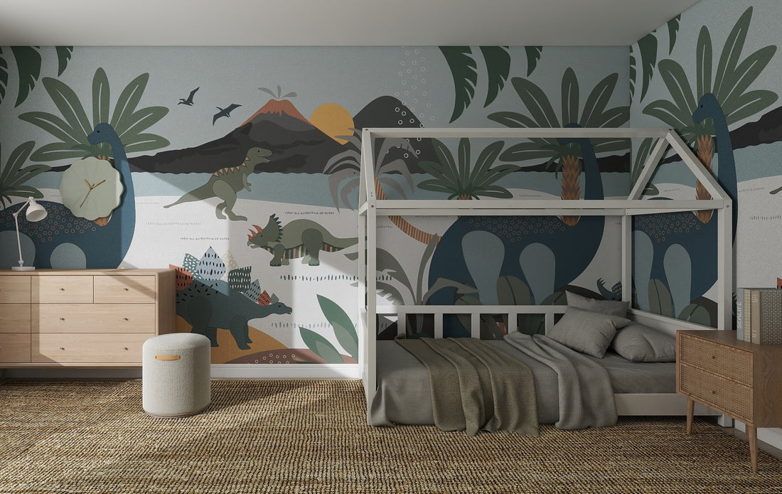 A children’s bedroom featuring the Dinosaur and Friends Wallpaper Mural, wooden furniture, a house-shaped bed frame, and a woven rug—earthy greens make it ideal for nurseries and playful kids’ spaces.