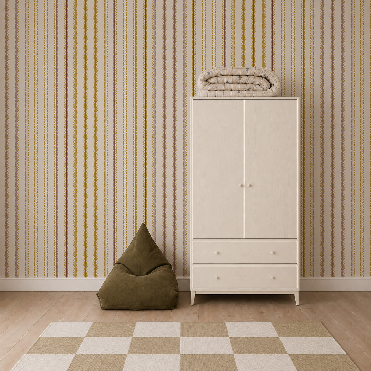 A minimalist room with a white wardrobe, a folded blanket on top, an olive green beanbag chair, Folk Scallop Stripe Wallpaper in Ochre &amp; Mocha, and a beige checkered rug on a light wood floor.