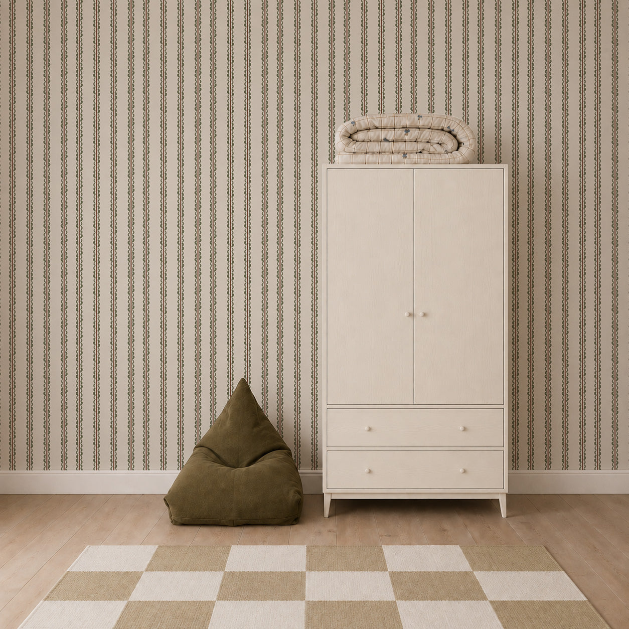 A room featuring Folk Scallop Stripe Wallpaper in Olive &amp; Mocha, a green bean bag chair, a beige wardrobe with a folded blanket on top, and a beige and white checkered rug on a light wood floor.