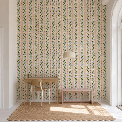 Forget-Me-Not Trail Stripe Wallpaper featuring a vertical striped pattern of green vines with small blue flowers and thin dotted lines on a light pink background.