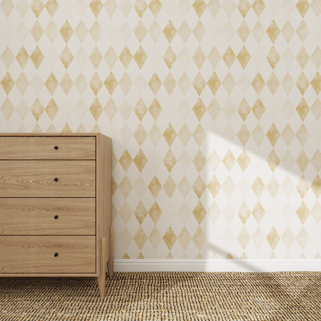 A wooden dresser sits on a woven rug before a wall adorned with Harlequin Watercolour Wallpaper Repeat Pattern | Mustard. Sunlight from the right creates shadows on the diamond-patterned surface.