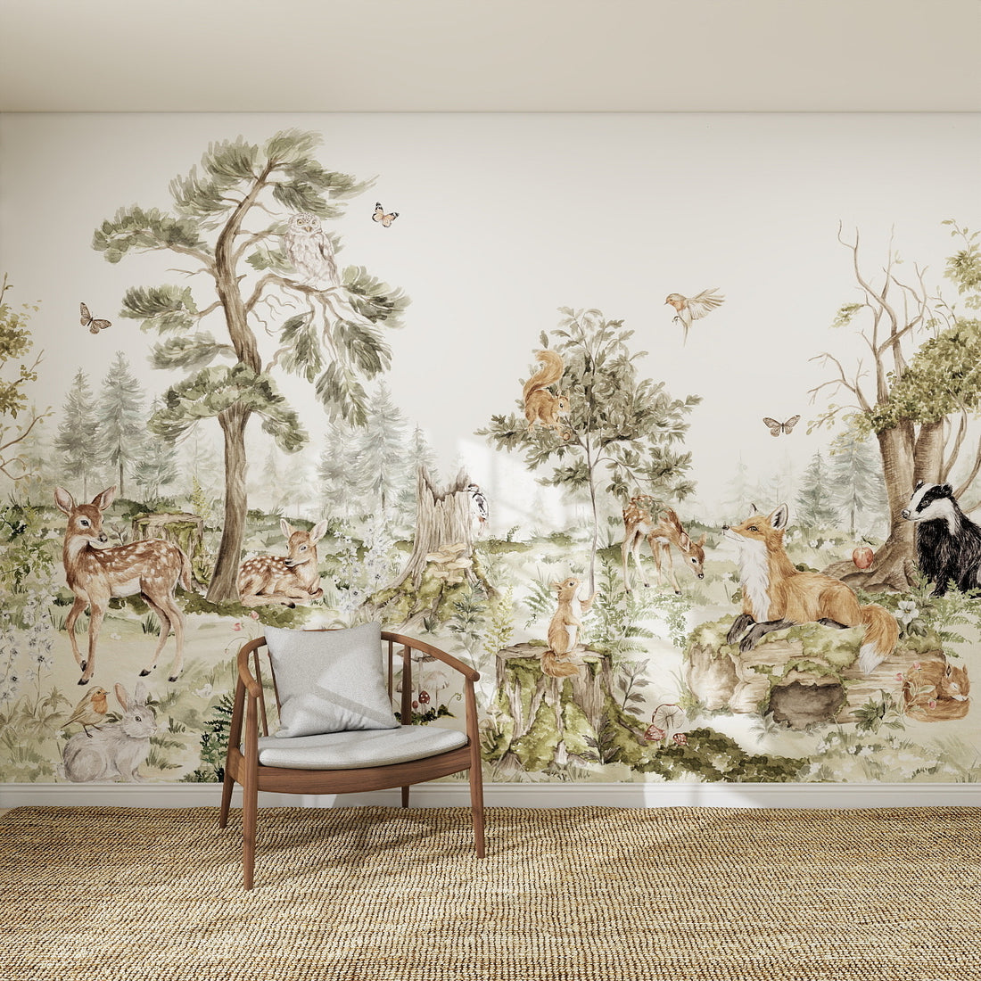 The Into The Forest Wallpaper Mural features illustrated foxes, deer, badgers, squirrels, rabbits, and birds among lush trees and greenery. A wooden chair with a cushion sits in front on a woven rug.