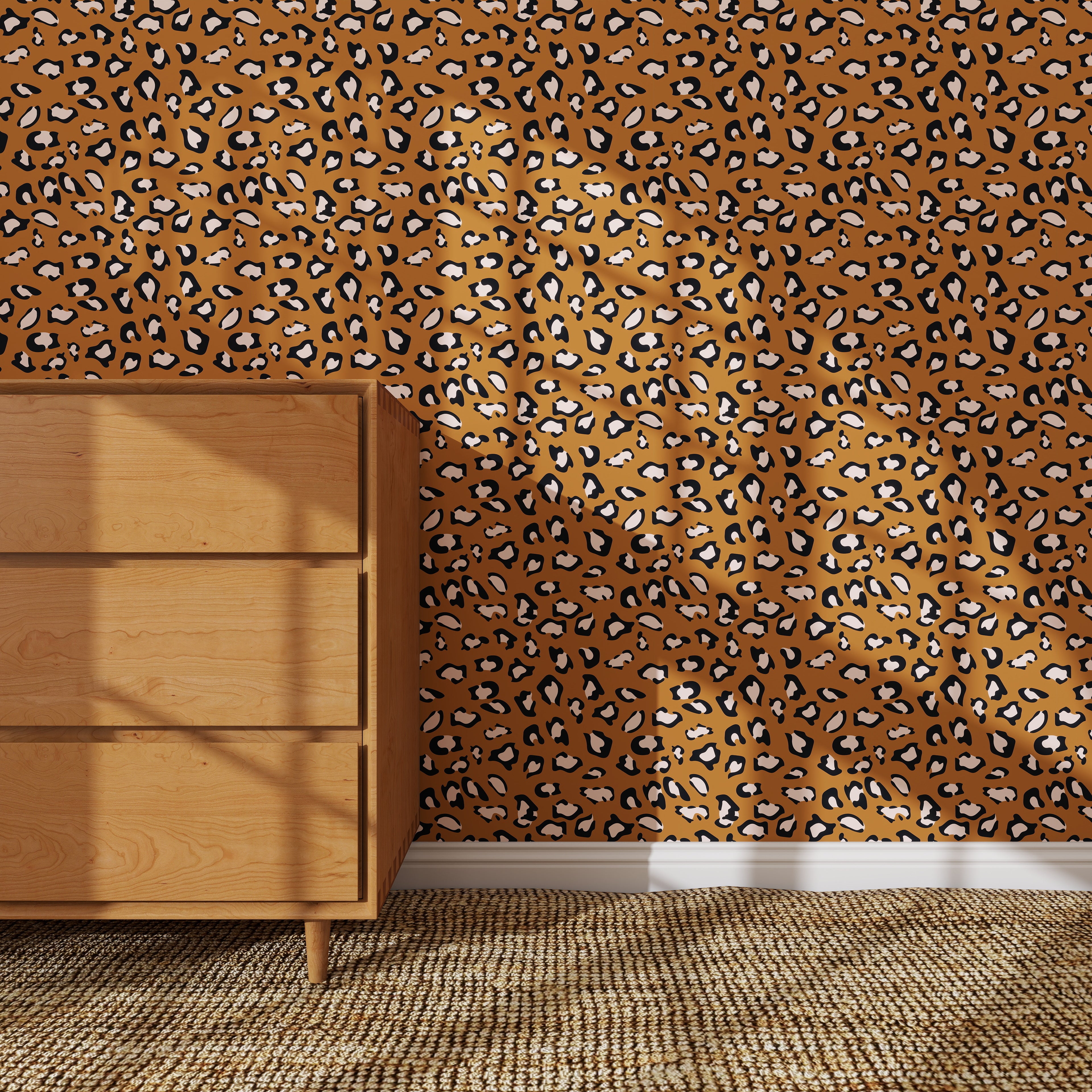 A wooden dresser stands on a woven rug next to a wall covered in Leopard Print Wallpaper Repeat Pattern, the bold brown and black design adding dramatic flair to the room.