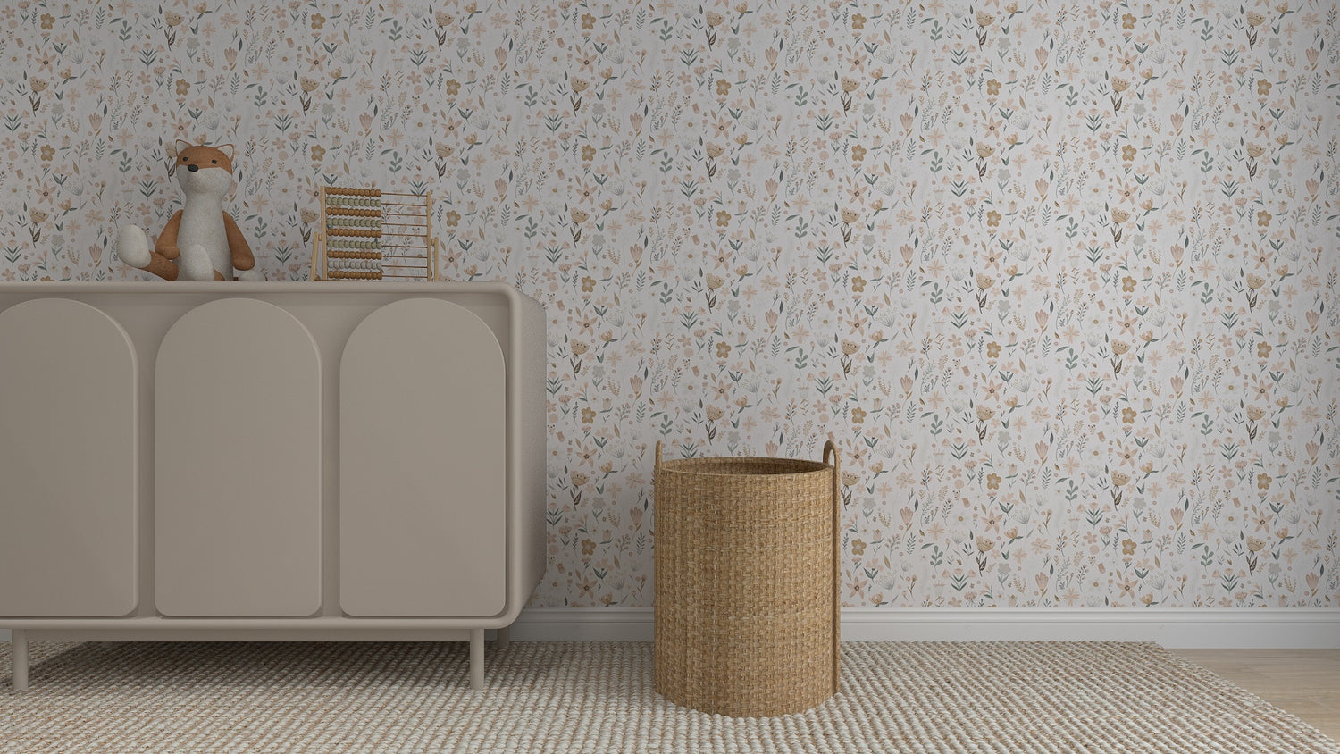 A neutral-toned nursery features a beige dresser, plush fox toy, stacked books, a woven laundry basket, and is finished with Millie Floral Wallpaper Repeat Pattern in soft pastel florals for an elegant touch.