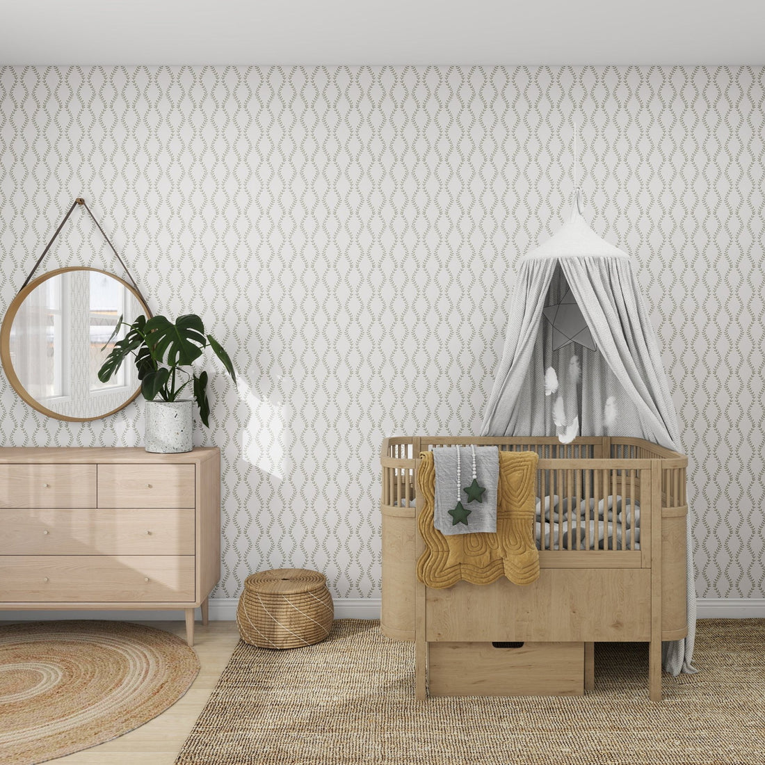 A cozy nursery showcases a light wood crib with a white canopy and star-patterned blanket, highlighting elegance. A wooden dresser with hand-drawn details, a round mirror, and potted plant complete the rooms munks and me Vintage Vines Wallpaper Repeat Pattern and natural woven rugs.
