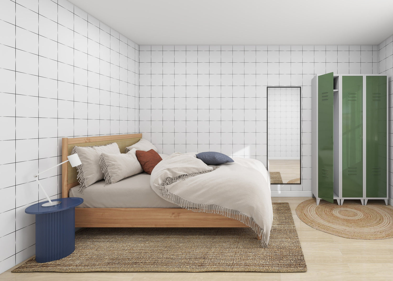 A minimalist bedroom features a wooden bed with layered pillows and a beige blanket. A blue side table holds a white lamp, while green lockers and a tall mirror sit on a woven rug against the Urban Grid Wallpaper Repeat Pattern by munks and me, enhancing the white tiled wall.