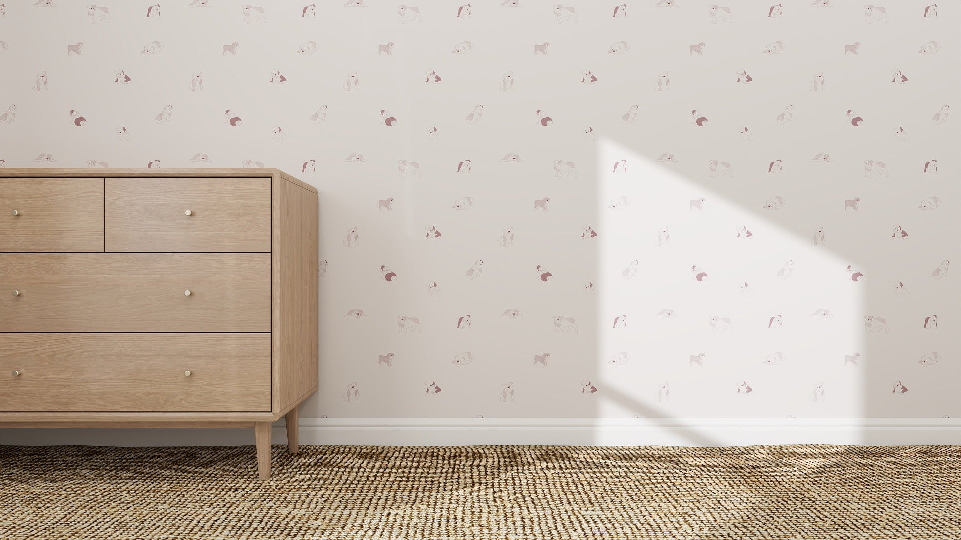 A light wood dresser with four drawers stands on a woven tan rug by a wall decorated with Ruffles Bull Dog Wallpaper Repeat Pattern | Rose. Sunlight casts a triangle-shaped shadow, adding charm to the cozy scene.