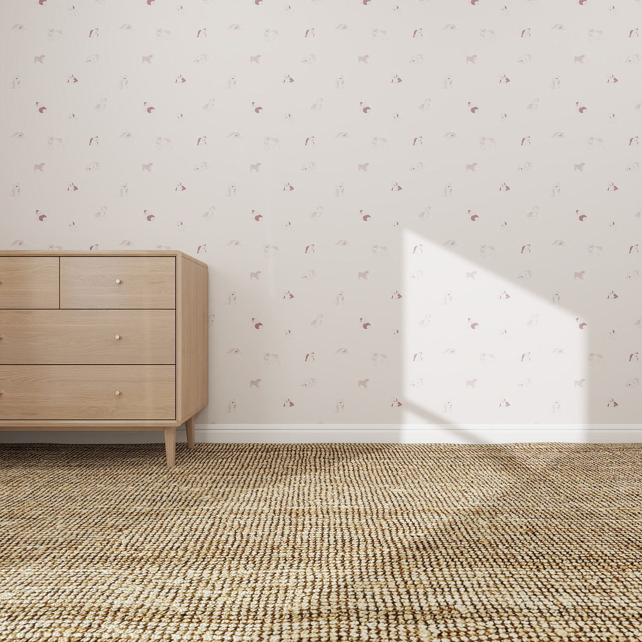 A minimalist room features the Ruffles Bull Dog Wallpaper Repeat Pattern in Rose, a light wood dresser, and a woven beige carpet. Sunlight casts bright shapes on the walls and floor, highlighting the decor’s playful charm.