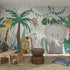 A playroom with wooden furniture and a vibrant Safari Wallpaper | Sample, featuring cartoon jungle animals—giraffe, lion, monkey, toucan, flamingo, and a large gray elephant among green plants.