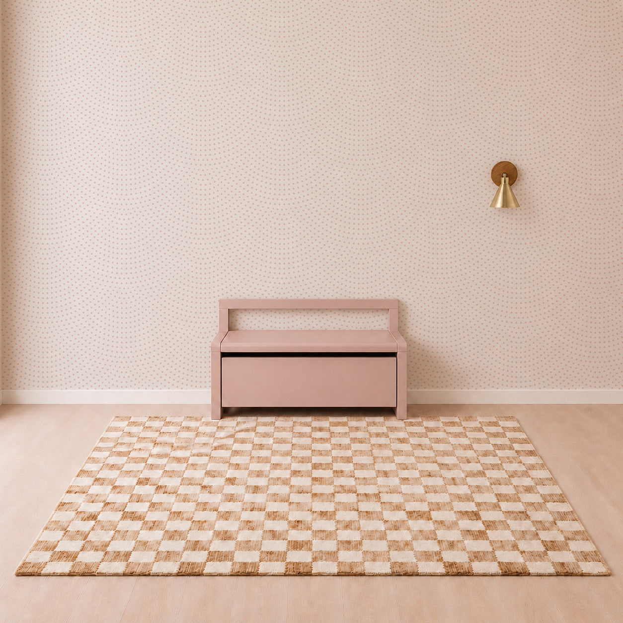 Minimalist room with a pink bench, patterned rug in beige and white checks, small dotted nursery wallpaper, and a single gold wall sconce on the right—beautifully complemented by the Scallop Shell Mural in Pink for a subtle coastal nursery décor.