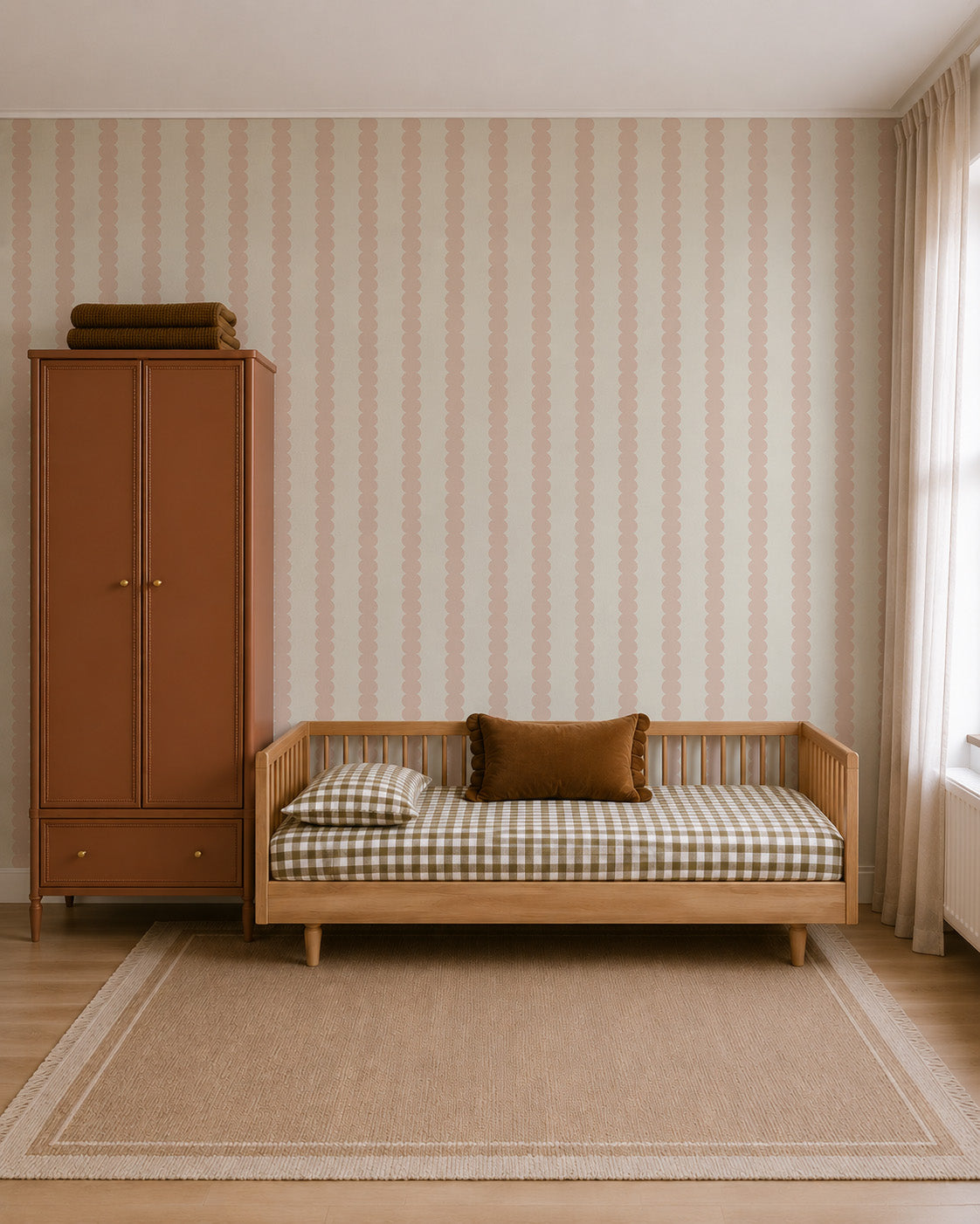 Scallop Stripe Wallpaper, Blush featuring a vertical pattern of blush pink scalloped stripes on a light background.