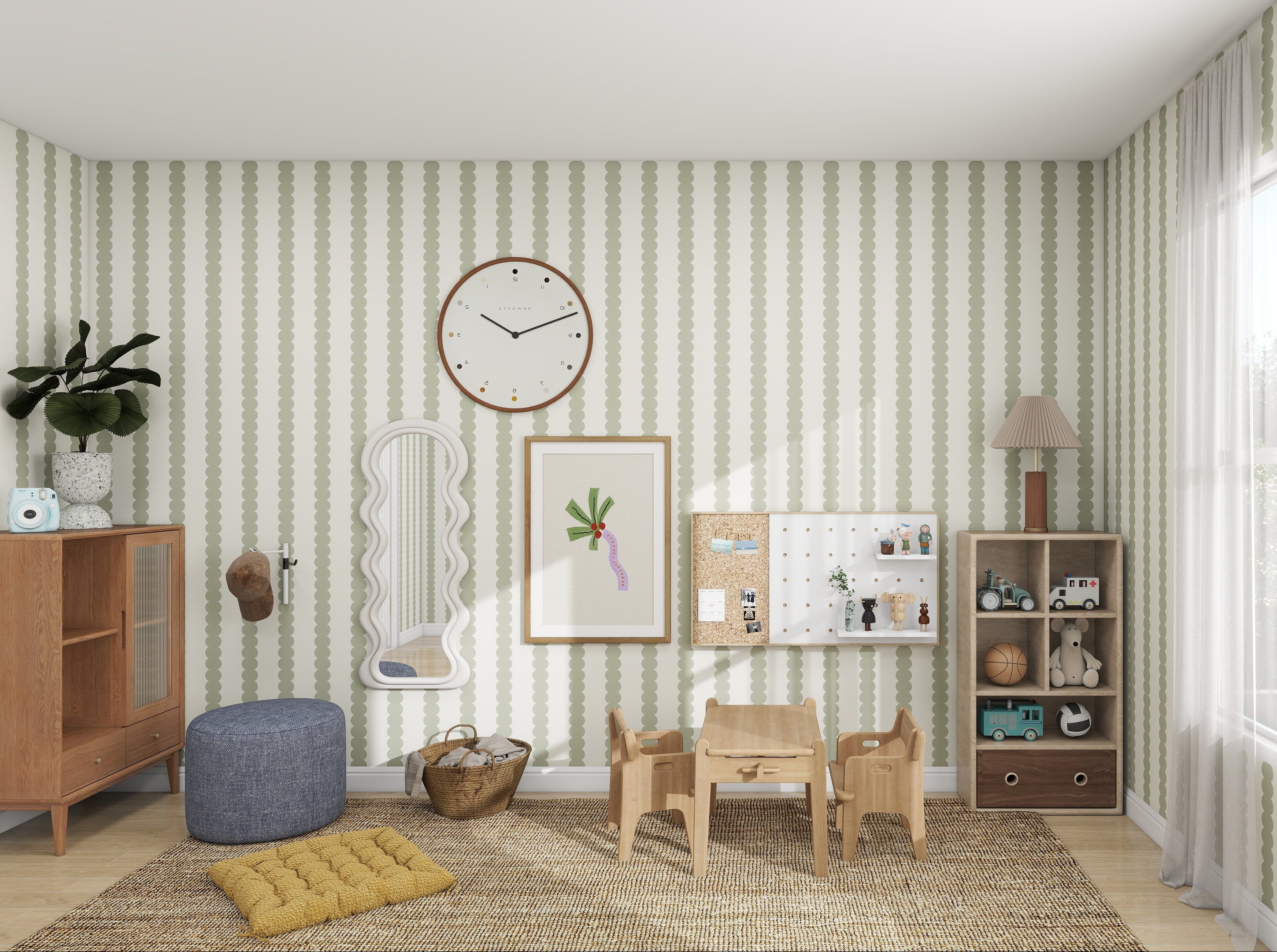 A childrens playroom with munks and mes Scallop Stripe Wallpaper Green features a small wooden table, chairs, a blue pouf, and a cabinet. Decor includes a wall clock, framed art, hanging pieces, and sunlight streaming onto the woven rug through the window.