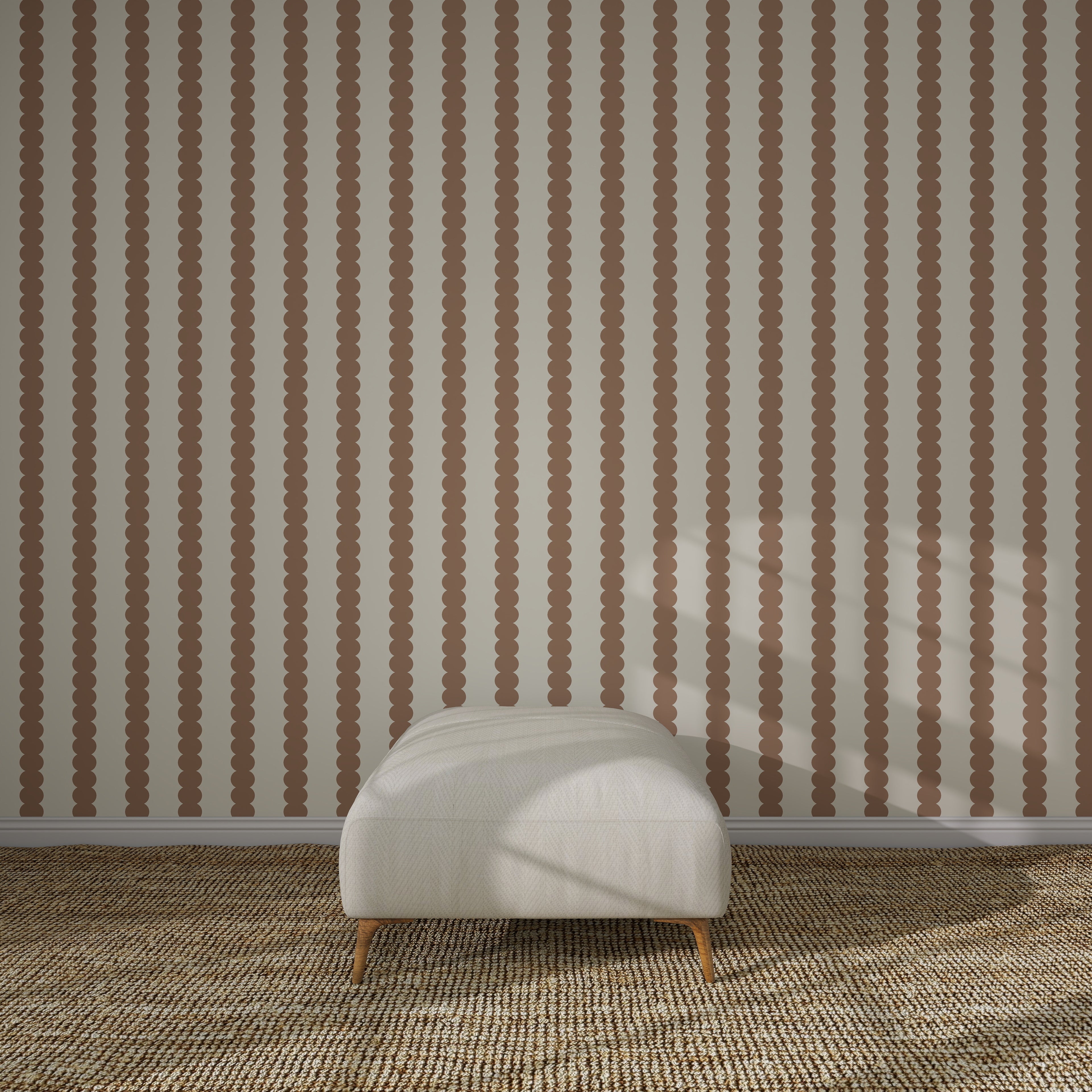 A minimalist room with Scallop Stripe Wallpaper, Latte, a textured beige carpet, and a cream ottoman—ideal for elegant kids’ rooms or as a serene nursery wallpaper backdrop.