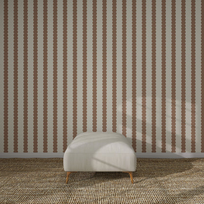 A minimalist room with Scallop Stripe Wallpaper, Latte, a textured beige carpet, and a cream ottoman—ideal for elegant kids’ rooms or as a serene nursery wallpaper backdrop.