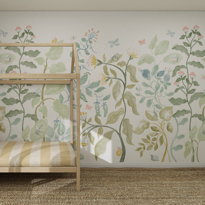 A children’s bedroom with a wooden bed, striped bedding, a natural woven rug, and Secret Garden Wallpaper Mural featuring large illustrated plants, flowers, and butterflies in soft green and pastel shades.