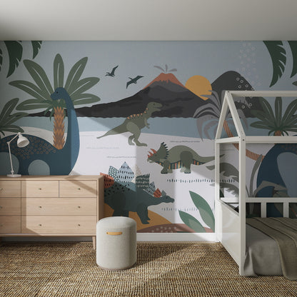 Children’s bedroom featuring the Dinosaur and Friends Wallpaper Mural with colorful dinosaurs, volcanoes, and palm trees. Includes a wooden dresser, white bunk bed, round ottoman, and woven rug for a playful nursery space.