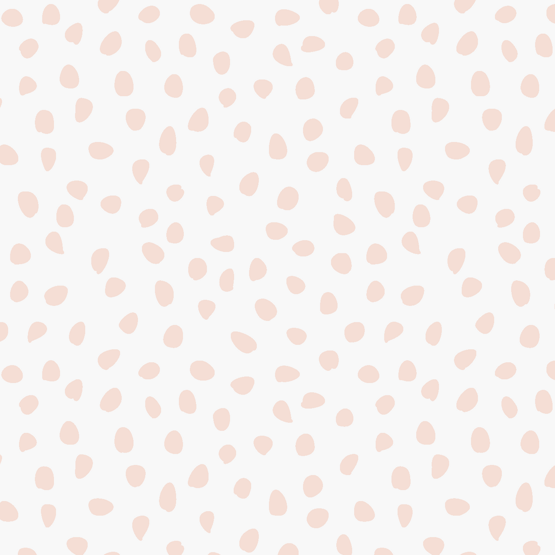 Sprinkle Wallpaper Sample, Pink features light pink, irregular polka dots scattered across a white background in a seamless, minimalist design. The varying sizes and shapes of the dots lend subtle charm and softness to any space, making this high-quality wallpaper an ideal choice for those seeking a playful yet understated look.