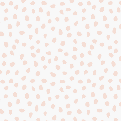 Sprinkle Wallpaper Sample, Pink features light pink, irregular polka dots scattered across a white background in a seamless, minimalist design. The varying sizes and shapes of the dots lend subtle charm and softness to any space, making this high-quality wallpaper an ideal choice for those seeking a playful yet understated look.