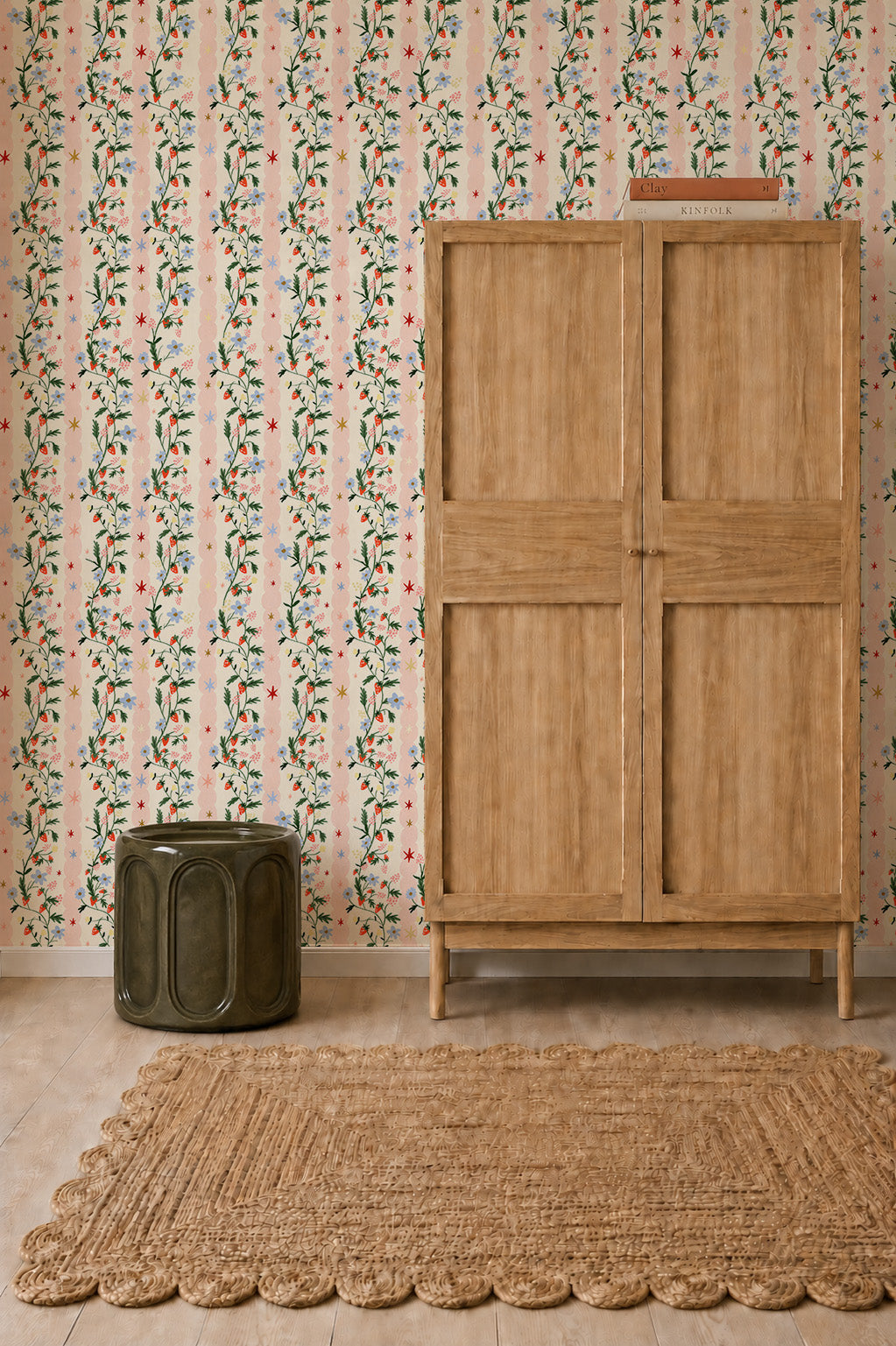 Strawberry Bloom Wallpaper sample featuring a repeating pattern of trailing vines, small blue flowers, and red strawberries over thin pink and white vertical stripes.