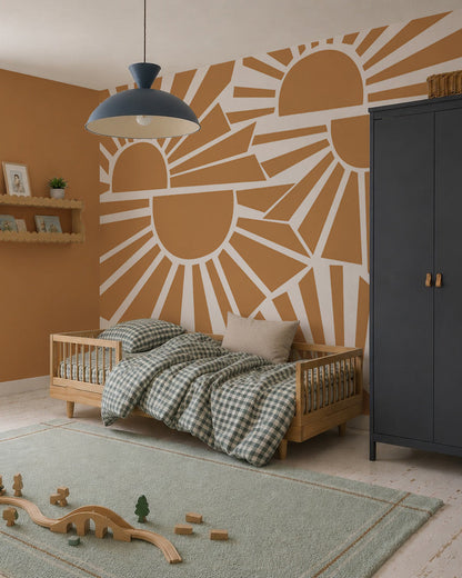 A cozy children’s bedroom with a wooden bed, green checkered bedding, blue rug with wooden toys, dark blue wardrobe, wall shelves with decor, and the Sunbeams Mural warming up the orange wall.