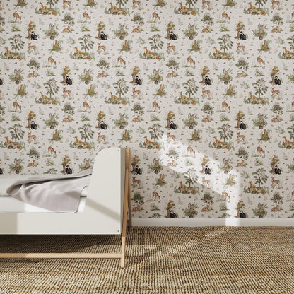 A children’s bedroom features a white wooden bed, light gray blanket, beige carpet, and is enhanced by the Tales Beneath The Trees Wallpaper Cream—an illustrated design of animals and plants in muted tones for a serene atmosphere.