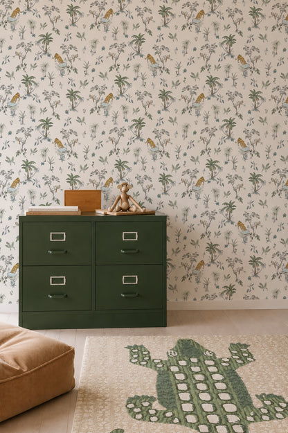 A children’s room with the Tropical Tiger Wallpaper Sample, a dark green dresser with toys, a tan floor cushion, and a rug showcasing a large green crocodile.